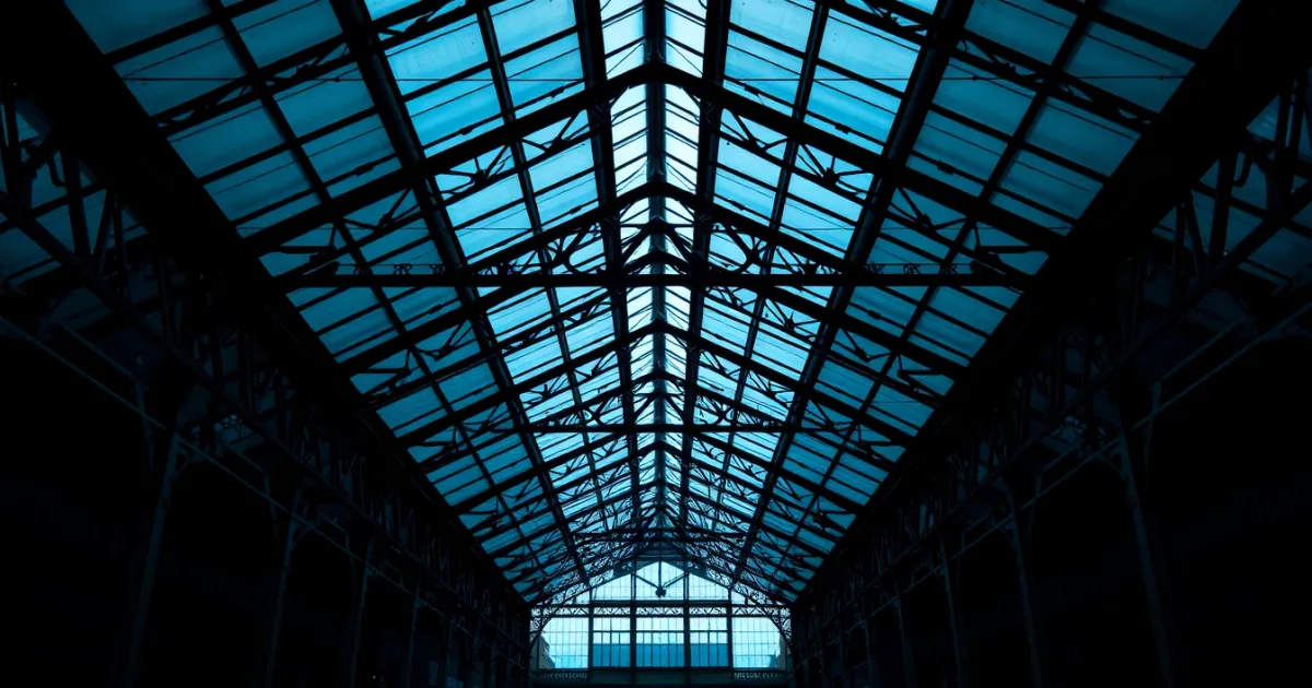Iron trusses beneath a Victorian railway station roof, illustrating child benefit and the high income charge