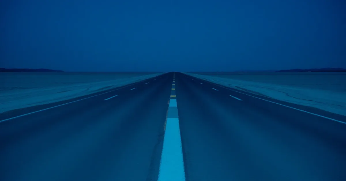 Two roads of different surfaces meeting on an empty plain, illustrating cross-border divorce and your taxes
